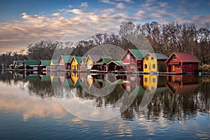 Tata, Hungary - Fishing cottages by the Lake Derito Derito to at sunset with reflections and colourful sky