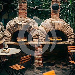 Tatars cooking in ovens at an outdoor cafÃ©