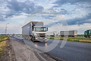 Tatarstan / Russia - July 05 2020: A Mercedes truck is driving along a large highway. In the oncoming lane there is a large traffi