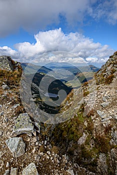 Tatra mountain peaks with tourist hiking trails in sunny summer day