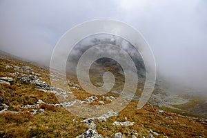 Tatra mountain peaks with tourist hiking trails in sunny summer day