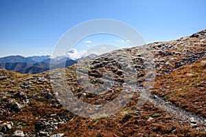 Tatra mountain peaks with tourist hiking trails in sunny summer day