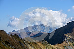 Tatra mountain peaks with tourist hiking trails in sunny summer day