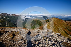 Tatra mountain peaks with tourist hiking trails in sunny summer day