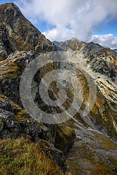 Tatra mountain peaks with tourist hiking trails in sunny summer day