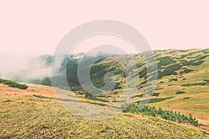 Tatra mountains in Slovakia covered with clouds - vintage effect