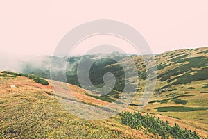 Tatra mountains in Slovakia covered with clouds - vintage effect