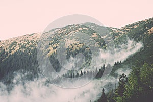 Tatra mountains in Slovakia covered with clouds - vintage effect