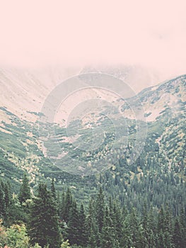 Tatra mountains in Slovakia covered with clouds - vintage effect