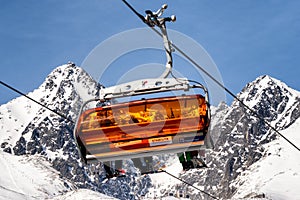 Ski lift and peak Lomnicky stit in High Tatras mountains in resort Tatranska Lomnica, Slovakia