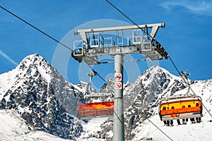 Ski lift and peak Lomnicky stit in High Tatras mountains in resort Tatranska Lomnica, Slovakia