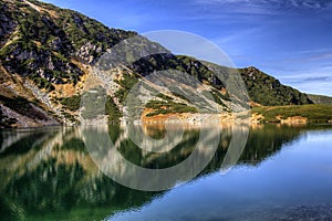 Tatry mountains in Poland - the lake reflecting mountains