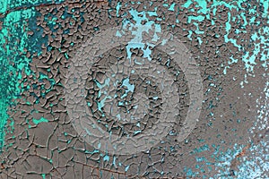 Tatter of a multi-colored old paint on a surface of a stone wall photo