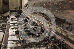 Tattered old abandoned piano 2