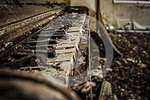 Tattered old abandoned piano