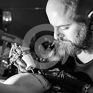 Tattoo artist making a tattoo