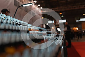 Tattoo color bottles on a tattoo expo.