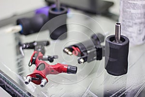 tattoo machine is on the table in a tattoo studio closeup