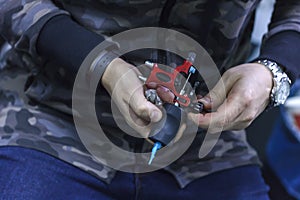 tattoo machine is on the table in a tattoo studio closeup