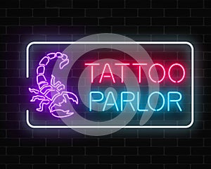 Tattoo parlor glowing neon signboard with scorpio emblem. Tattooing salon sign in rectangle frame.