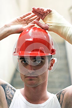 Tattooed man in plaster