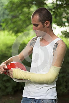 Tattooed man in plaster