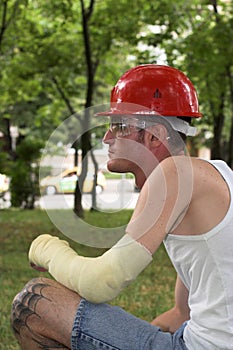 Tattooed man in plaster