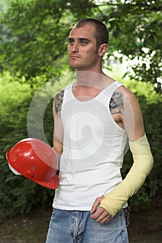 Tattooed man in plaster