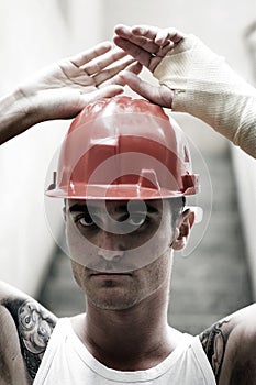 Tattooed man in plaster