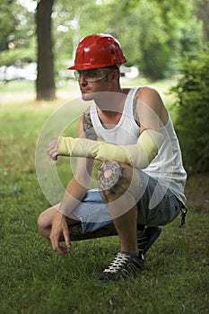 Tattooed man in plaster