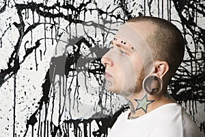 Tattooed and pierced man. photo