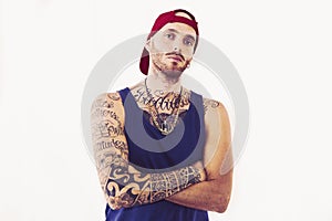 Tattooed rap singer posing in studio