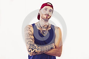 Tattooed rap singer posing in studio photo