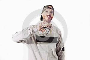 Tattooed rap singer posing in studio