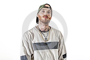 Tattooed rap singer posing in studio