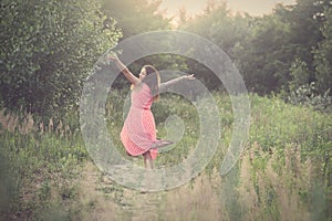 Tattooed Woman Dancing on Forest Glade