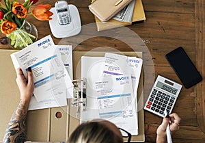 Tattooed Woman doing accounting work