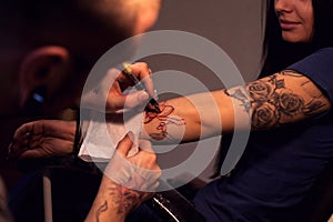 Tattooer makes scetch photo