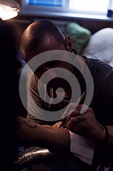 Tattooer makes scetch