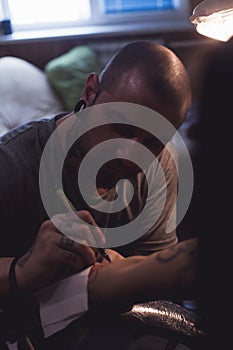 Tattooer makes scetch