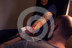 Tattooer makes scketch