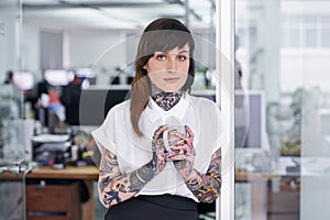 Tattoos, coffee and portrait of business woman in office with positive, good and confident. Grunge, cappuccino and