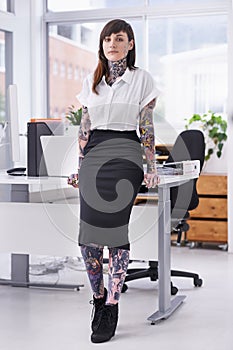 Tattoos, portrait and business woman in office with positive, good and confident attitude. Grunge, pride and