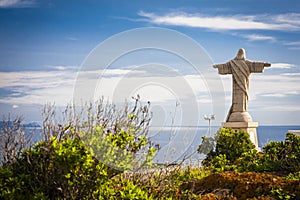 Tatue of Jesus Christ at Garajau in Funchal with amazing areal view, Madeira photo