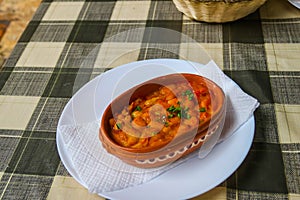 Tavche gravche (baked beans) - traditional Macedonian dish on table