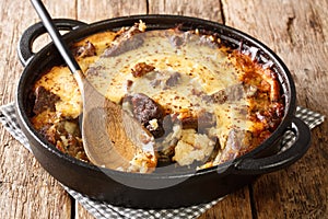 Tave kosi baked lamb and rice with yoghurt close-up in a pan. horizontal photo