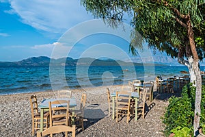 Taverna with table and chairs on Nikiana beach