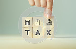 TAX concept, on wooden block  including of State taxes,Tax payment, Governant ,calculating finance, tax accounting, statistics and