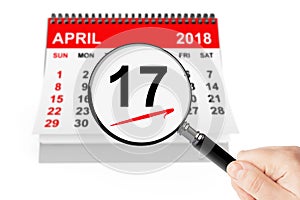 Tax Day Concept. 17 april 2018 calendar with magnifier