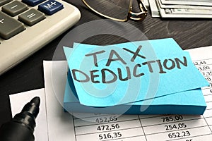 Tax deduction written on a piece of paper